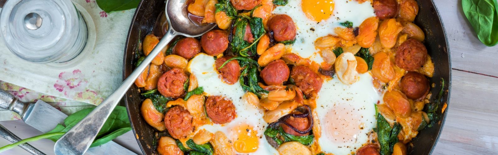 Butter beans, chorizo and spinach baked eggs