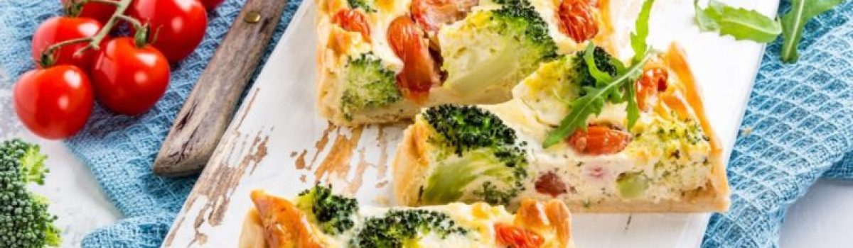 Veg quiche with cherry tomatoes, broccoli and cheese